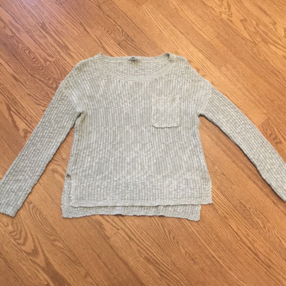 Blue gray sweater with front pocket and side slits